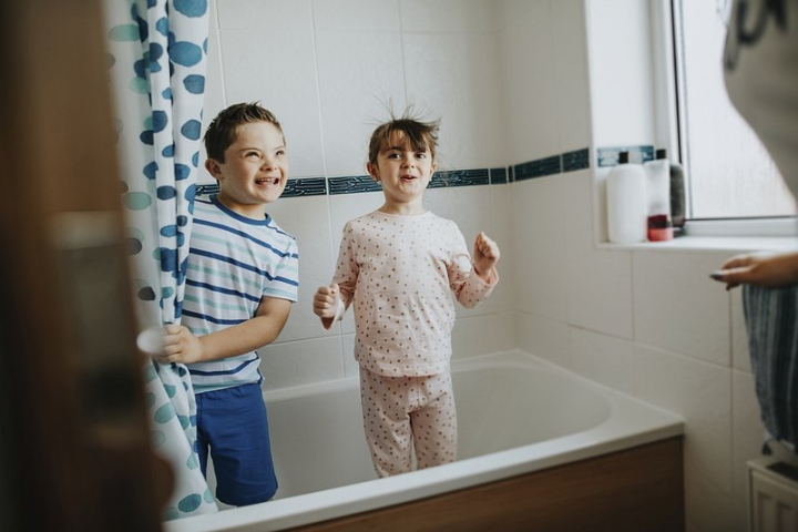 bathroom,bathtub,disability,down syndrome,disabled,children disability,siblings,shower,playing,child,washing,kids pajamas,rawpixel