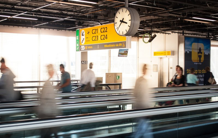 airport terminal,airport,time travel,business,flight,airport travel,time clock,airport crowd,arriving on. time,transport,motion,person photo,rawpixel