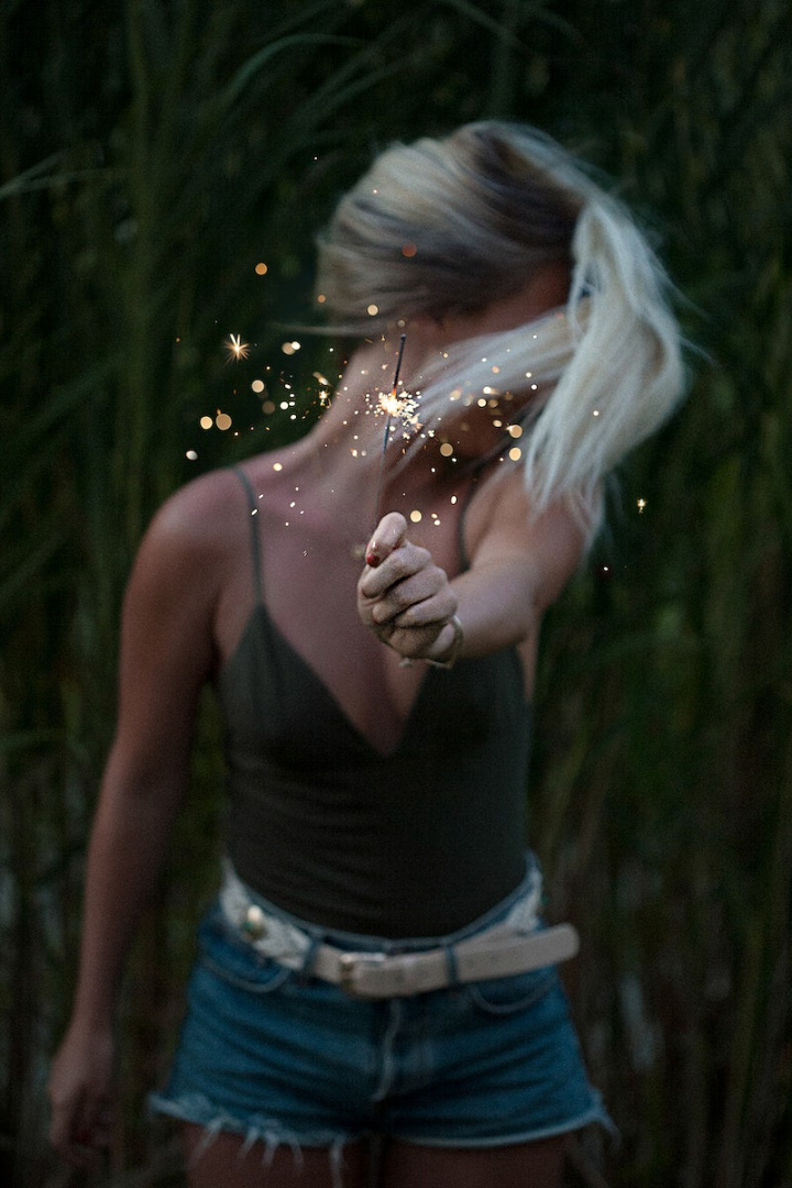 new year,birthday,birthday people,beauty girl,girl birthday,woman photos,girl,sparklers,summer,girl beautiful,a girl is standing in the darkness,eve,rawpixel