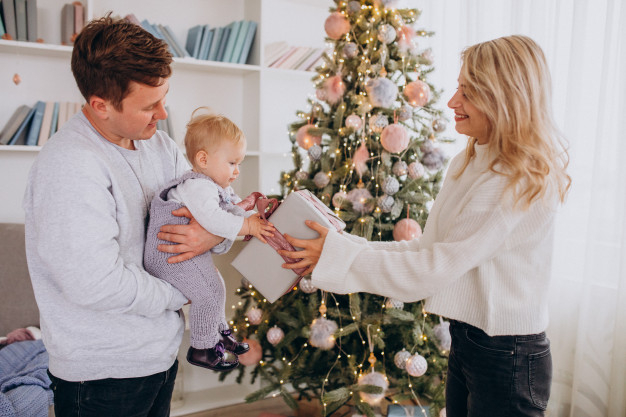 Premium Photo  Young mom with kids holding christmas presents