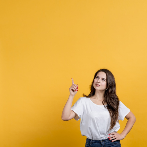 hacia,senalando,arriba,copyspace,chica,amarillo,joven,sobre,posture,feeling,pointing,teen,up,expression,background yellow,emotion,fondo,young,female,finger,teenager,yellow background,person,yellow,human,face,girl,woman,background