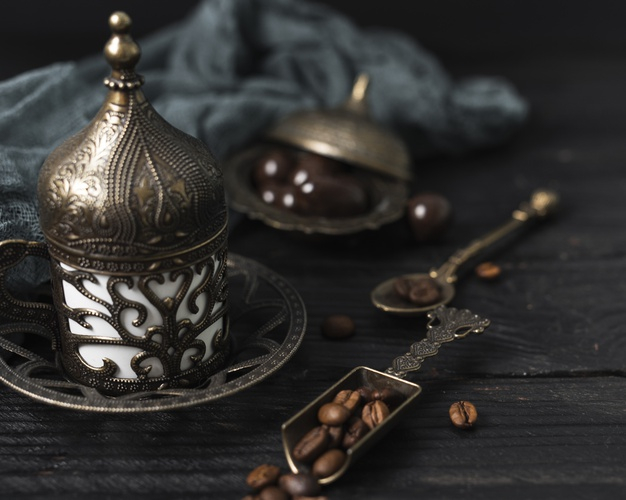 high angle,caffeine,defocused,high,tray,angle,horizontal,turkish,beans,beverage,teapot,textile,hot,cloth,coffee beans,spoon,fabric,plate,cup,drink,silver,candy,chocolate,coffee