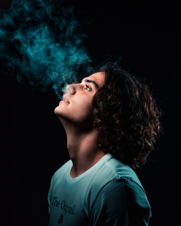Free: Photo of Man Smoking in Black Background 