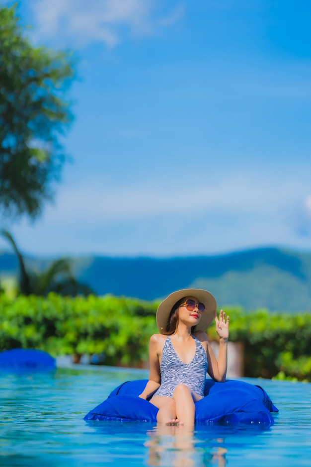 Teen girl in bikini against Blue sky, Stock Photo, Picture And