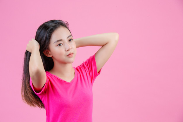 AI generated young woman poses for the camera in pink dress with pink hair,  35379617 Stock Photo at Vecteezy