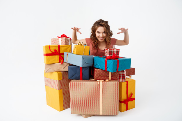 wishlist,cheerful,casual,colored,surprised,curly,boxes,young,jeans,surprise,present,box,woman,gift,party,ribbon,christmas
