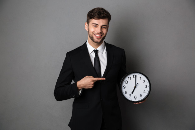 gesturing,businessperson,caucasian,punctuality,bearded,brunette,attractive,confident,cheerful,handsome,hurry,deadline,pointing,adult,holding,hour,guy,successful,executive,control,male,alarm,manager,professional,jacket,young,classic,management,suit,tie,employee,finger,businessman,elegant,time,shirt,happy,hands,clock,man,business