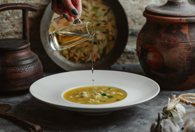 adding,broth,cooked,authentic,delicious,meal,olive oil,soup,traditional,olive,dinner,oil,chicken,kitchen,restaurant,food