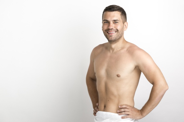 shirtless,copyspace,bodycare,indoors,closeup,stubble,bare,charming,against,simplicity,waist,wellbeing,confident,cheerful,handsome,surface,standing,looking,smiling,one,adult,guy,skincare,male,positive,lifestyle,portrait,bath,simple,young,care,youth,studio,body,person,backdrop,white,human,wall,happy,smile,hands,man,camera,people,background