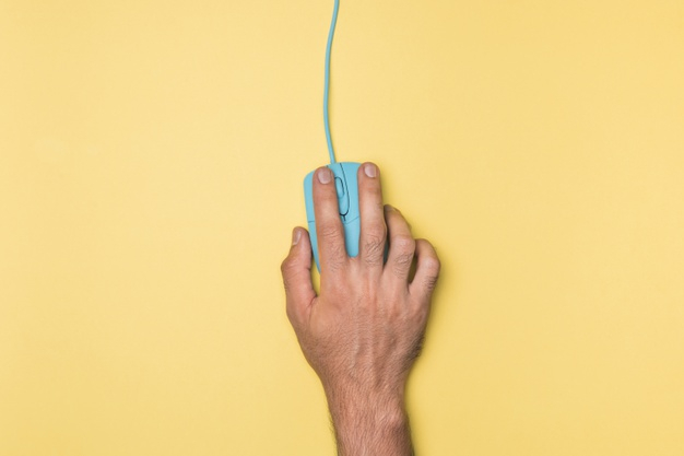 wired mouse,wired,minimalistic,horizontal,holding,computer mouse,top view,top,colourful,view,colourful background,workspace,minimal,minimalist,workplace,studio,mouse,yellow background,yellow,art,blue,computer,hand,technology,background