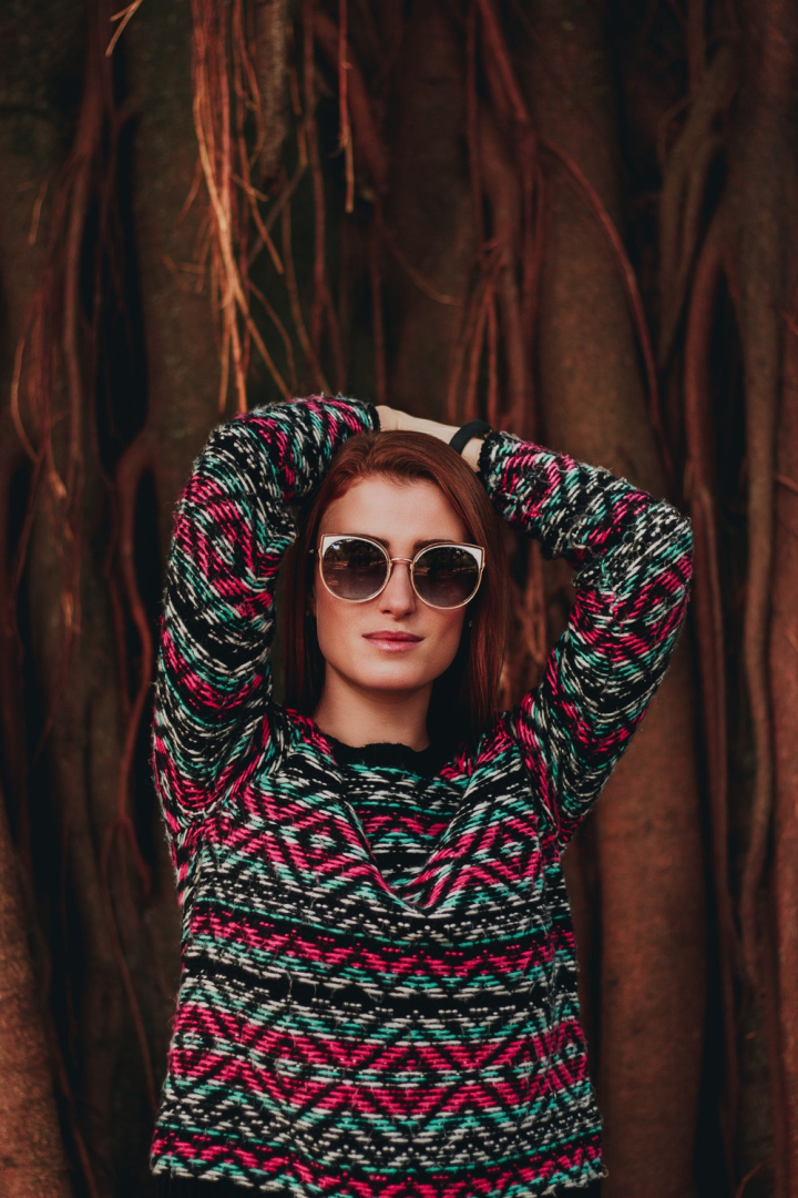 Free: Photo of Woman in Sunglasses Posing with Her Hands Over Her