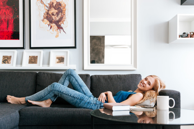 Young woman lying down and resting. Interior and design of