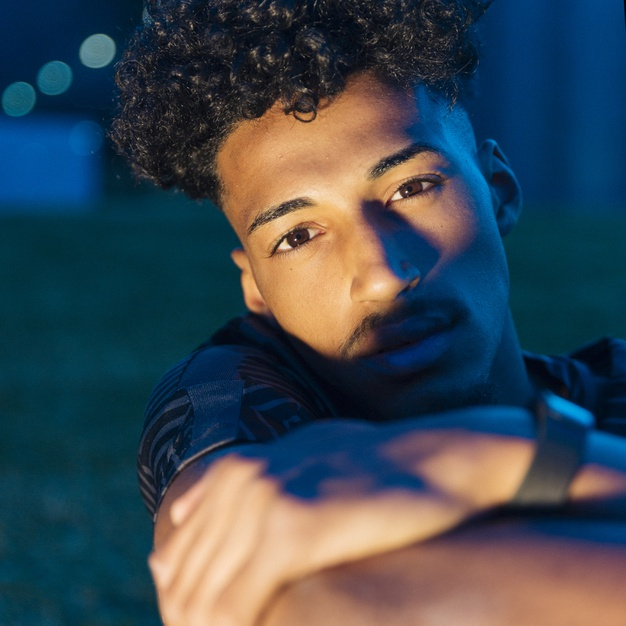 unsmiling,square format,folded arms,unemotional,looking at camera,pensive,gaze,youngster,focused,thoughtful,dusk,twilight,serious,darkness,format,upset,confident,handsome,african american,evening,relaxing,folded,dreaming,outdoors,looking,calm,blurred,arms,football field,haircut,male,american,blurred background,teen,portrait,hairstyle,field,african,beard,ethnic,bokeh,night,person,square,black,football,man,camera,background