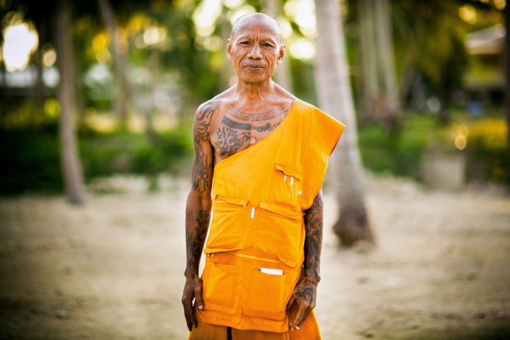 adult,blurred background,culture,daylight,man,monk,old man,outdoors,portrait,relaxation,religion,religious,selective focus,smile,spirituality,street,summer,tattooed,tradition,traditional,travel,wear