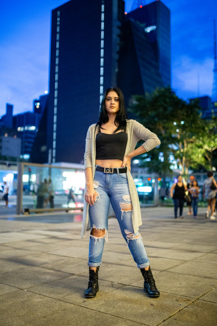 black top,blur,cardigan,crop top,dark hair,depth of field,fashion,female,focus,looking,model,modeling,outdoors,outfit,pavement,photo session,photoshoot,posing,ripped jeans,standing,style,urban,woman
