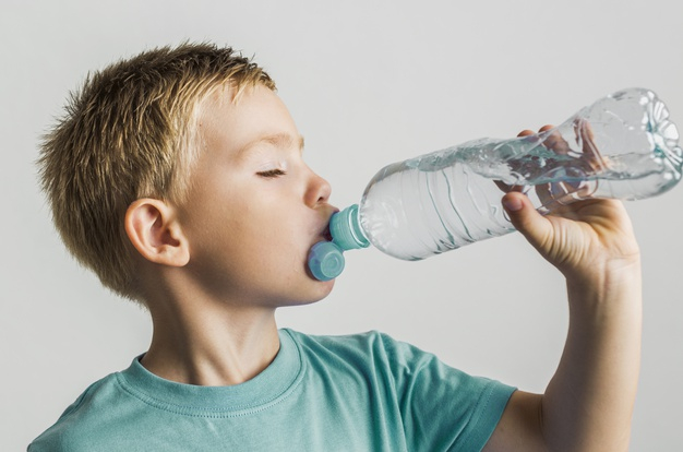 Close Up Photo Of A Thirsty Teen Boy Drinking Fresh Water From Plastic  Bottle Outdoors Sunny Day. Stock Photo, Picture and Royalty Free Image.  Image 48779037.
