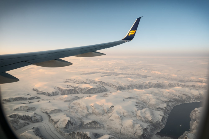 aerial,air,aircraft,airliner,airplane,altitude,aviation,clouds,daylight,flight,fly,flying,high,ice,landscape,outdoors,plane,scenic,sky,snow,sunset,transportation system,travel,winter,winter landscape
