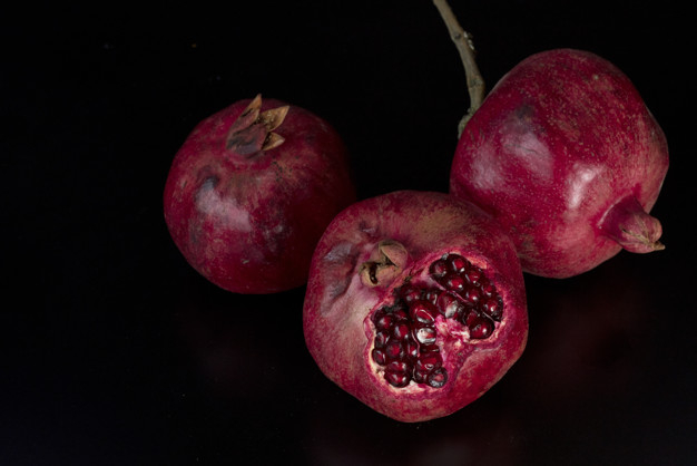 pomegranates,exotic,tasty,big,delicious,top,view,pomegranate,healthy,sweet,tropical,black,fruit,red