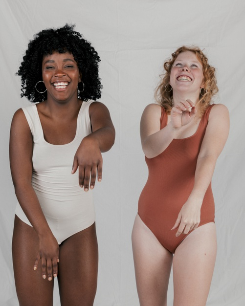multiethnic,multiracial,overjoyed,toned,interracial,indoors,variation,bonding,diverse,against,tan,contrast,togetherness,blonde,front,difference,two,real,standing,smiling,compare,adult,comparison,curly,afro,diversity,bikini,lifestyle,portrait,happiness,fair,young,dark,together,female,african,friendship,grey,lady,funny,fun,natural,body,backdrop,women,happy,smile,black,camera,light,woman,people,background