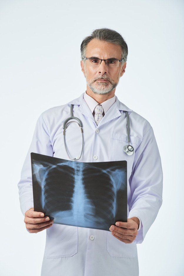 practitioner,pneumonia,examining,experienced,radiology,confident,ribs,standing,looking,occupation,shot,xray,holding,lungs,chest,pocket,ray,portrait,professional,uniform,stethoscope,healthcare,service,doctor,man,camera,medical