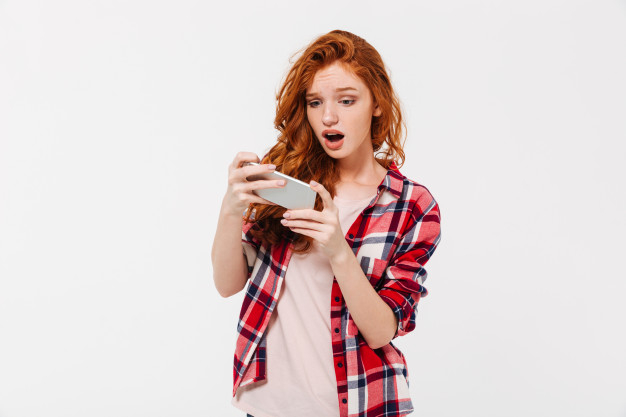 Free: Portrait of an excited pretty girl playing games Free Photo 