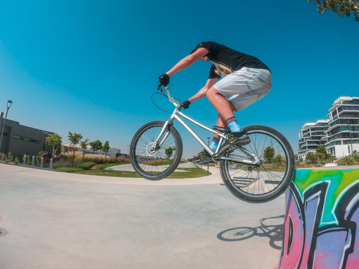 action,action energy,active,bicycle,bike,daylight,daytime,extreme sport,freestyle,hobby,jump,leisure,outdoors,person,recreation,sport,street,stunt,tricks,wheels