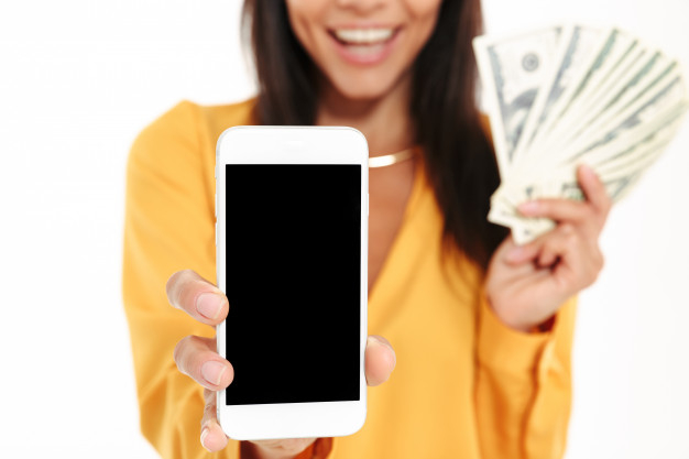 ecstatic,demonstrate,closeup,wages,showing,excitement,wealth,purchase,surprised,satisfaction,luck,adult,holding,blank,close,concept,banking,currency,cell,buy,smart,young,cellphone,female,screen,lady,bank,success,person,note,mobile,phone,woman,money,people