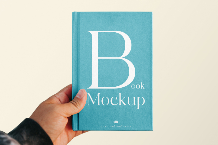 Free,Book,Cover,with,Hand,Mockup,book cover,editorial,hard cover book,stationery