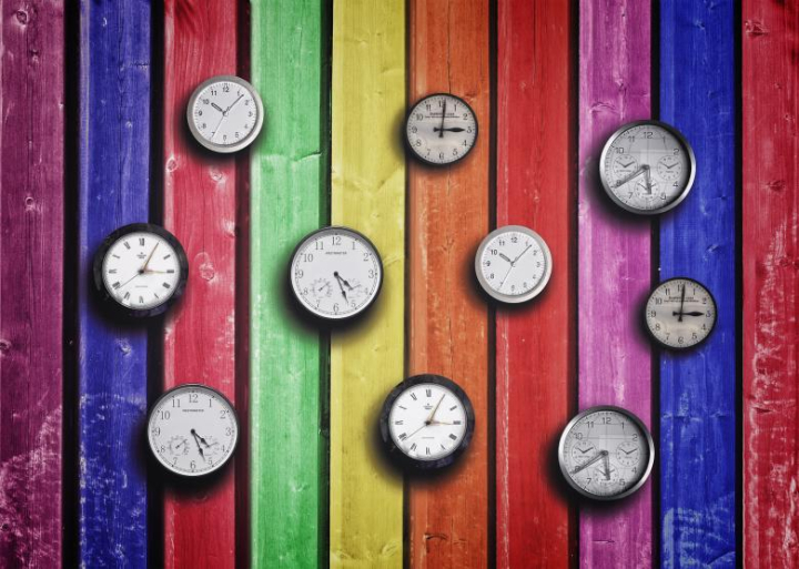 clocks-on-colorful-wood-background-time-concept-nohat-free-for-designer