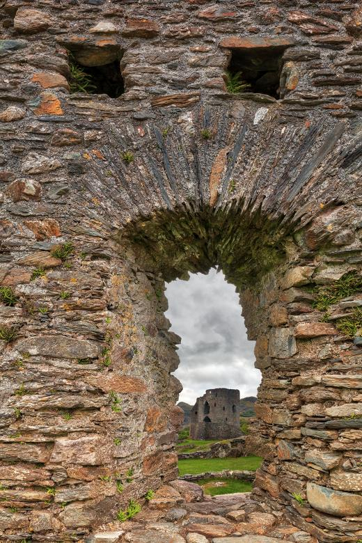 castle,wall,tower,ruins,wales,fort,fortress,fortification,stronghold,ruin,architecture,architectural,building,landmark,structure,construction,walls,arrowslit,arrow,slit,stone,stones,rock,rocks,landscape,scene,view,vista,mountain,mountains,hill,hills,plant,plants,grass,vegetation,sky,cloud,clouds,cloudy,overcast,atmosphere,atmospheric,environment,environmental,background,backdrop,dolwyddelan,dolbadarn,welsh,cymru,uk,united,kingdom,great,britain,wanderlust,travel,outside,outdoor,outdoors,exterior,beauty,beautiful,pretty,epic,surreal,ethereal,fantasy,fantastic,concept,conceptual,personify,personified,personification,anthropomorphize,anthropomorphiza,face,head,eye,eyes,mouth,grimace,grimacing,gasp,scream,screaming,shock,shocked,surprise,surprised,scare,scared,scary,horror,emote,emoticon,funny,humor,humorous,humour,humourous,comic,comical,nostalgia,nostalgic,retro,old,oldworld,old-world,oldstyle,old-style,vintage,age,aged,aging,ancient,medieval,middle-ages,middle,ages,history,historic,historical,heritage,legacy,abandoned,dilapidated,disrepair,rundown,neglect,neglected,forlorn,texture,textured,textural,worn,weathered,raw,rough,grunge,grungy,grunginess,grime,grimy,griminess,grit,gritty,grittiness,leading,line,lines,curve,curves,winding,triangle,triangles,triangular,arch,arches,arched,archway,arc,arcs,rectangle,rectangles,rectangular,geometry,geometric,geometrical,perspective,composition,frame,framed,framing,closeup,close-up,close,up,composite,contrast,contrasted,contrasting,shade,shades,shadow,shadows,highlight,highlights,light,lights,vivid,green,yellow,orange,brown,beige,maroon,white,grey,gray,black,color,colour,colors,colours,colorful,colourful,vibrant,vibrance,vibrancy,somadjinn,nicolasraymond,netstockvault