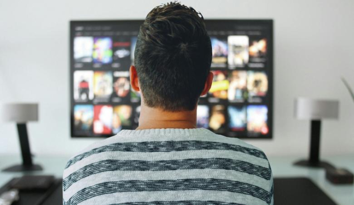 television,man,watching,room,office,modern,technology,screen,control,home,desk,table,concept,video,netflix,entertainment,media,digital,film,presentation,play,network,searches,episode,movies,netstockvault