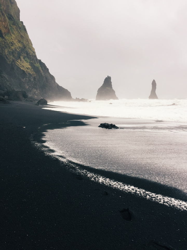 Free: A moment on Reynisfjara, the black sand beach in southern Iceland.  The beach can get quite populated with tourists but patience with the  crowds allowed for this moment. 