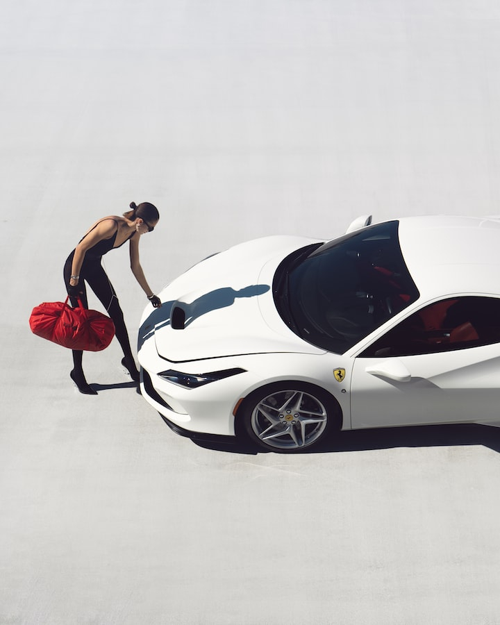 car,super car,sport car,woman,red bag,white sport car