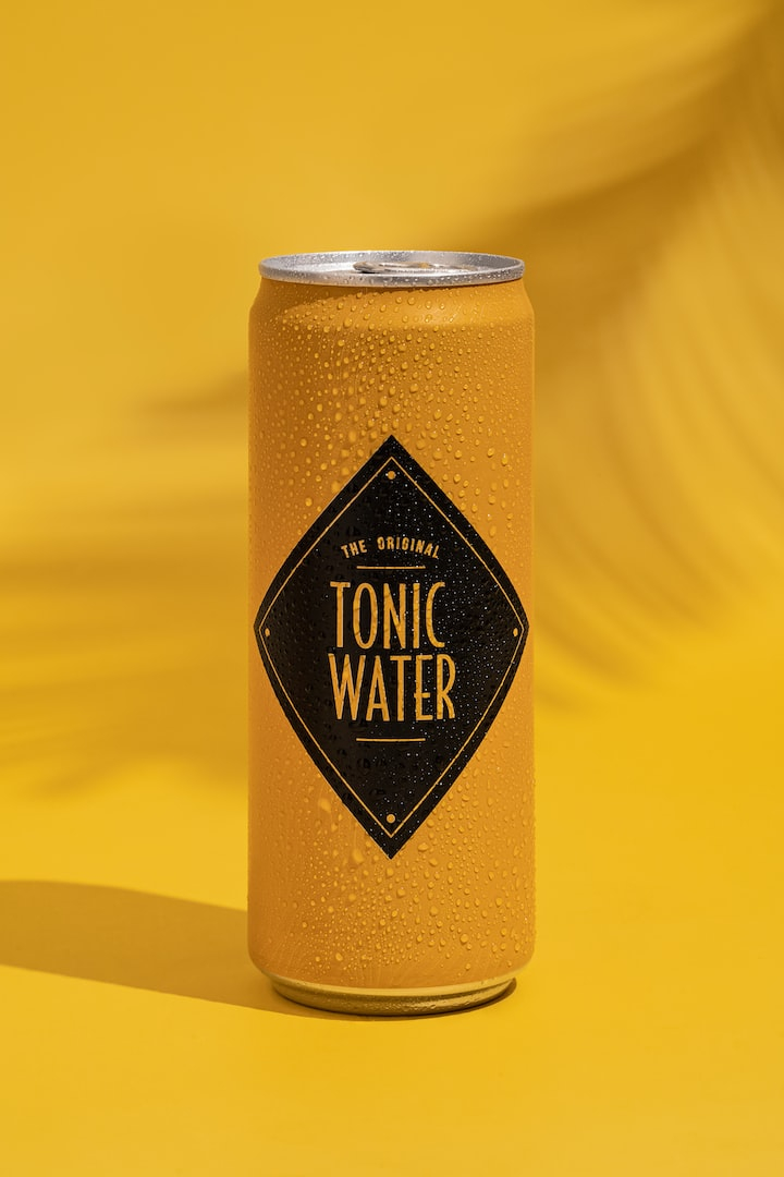 product photography,hard lighting,hard light shadows,tonic,product photograph,product photos,tonic water,product photo,product photoshoot,brown backgrounds,beer,beverage,drink,alcohol,bottle,tin,can,lager,glass,free pictures,unsplash,yellow