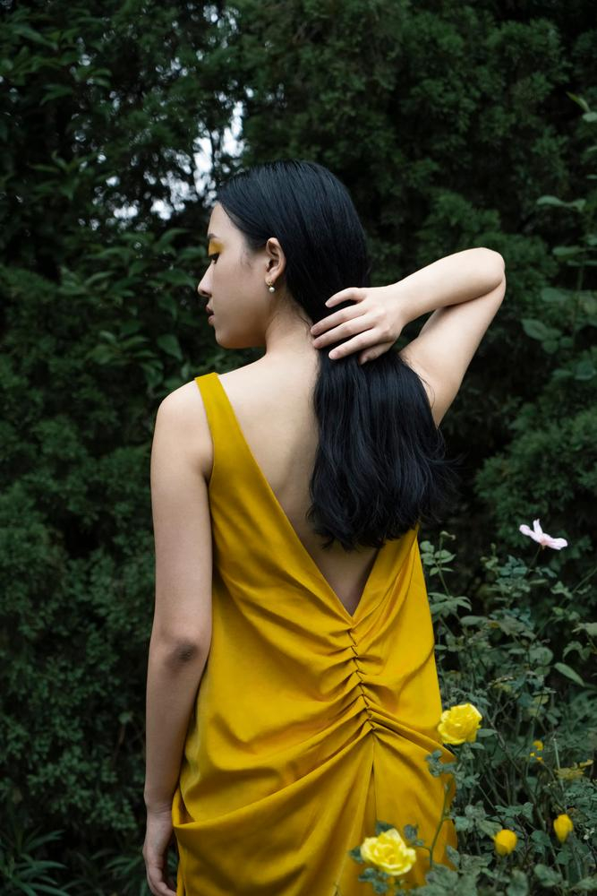 women,woman,young,asian,one,1,person,people,beauty,beautiful,cute,sexy,season,youth,colorful,style,outdoor,portrait,yellow,green,summer,fashion,trendy,nature,natural,model,female,feminine,art,creative,leaf,tree,concept,magazine,promo,spring,back,clothing,clothes,dress,v-shape,cutout,body,bush,flower,roses,side,mysterious,look,face,xframe