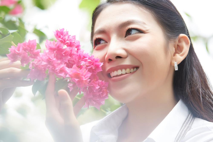 female,smiling,looking,bougainvillaea,flower,enjoy,watching,posing,outside,young,lady,woman,comfortable,asia,asian,attractive,lovely,sunlight,branch,tree,plant,purple,pink,happy,cheerful,joyful,lifestyle,relax,fresh,white,skirt,beauty,beautiful,leaves,holding,close,portrait,thai,earring,mom,outdoors,xframe