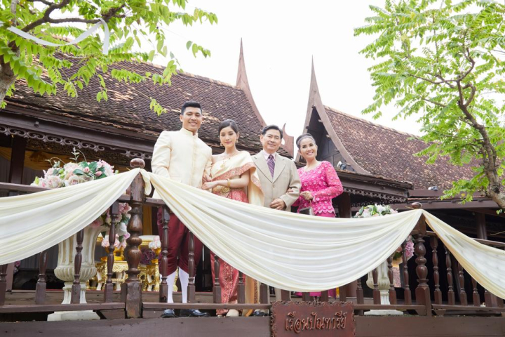 married couple,parents,smiling,looking,camera,people,relatives,vintage,dress,engagement,romantic,asia,asian,elegant,wedding reception,elegance,together,suit,standing,outside,congratulation,joyful,delightful,thailand,thai,family,mature,wedding,thai style,celebration,man,woman,male,female,young,floral,flower,bloom,balcony,culture,relationship,attractive,adult,bridal,traditional,outdoor,life event,marriage,happy,happiness,wife,khan maak,betel bowl,father,xframe
