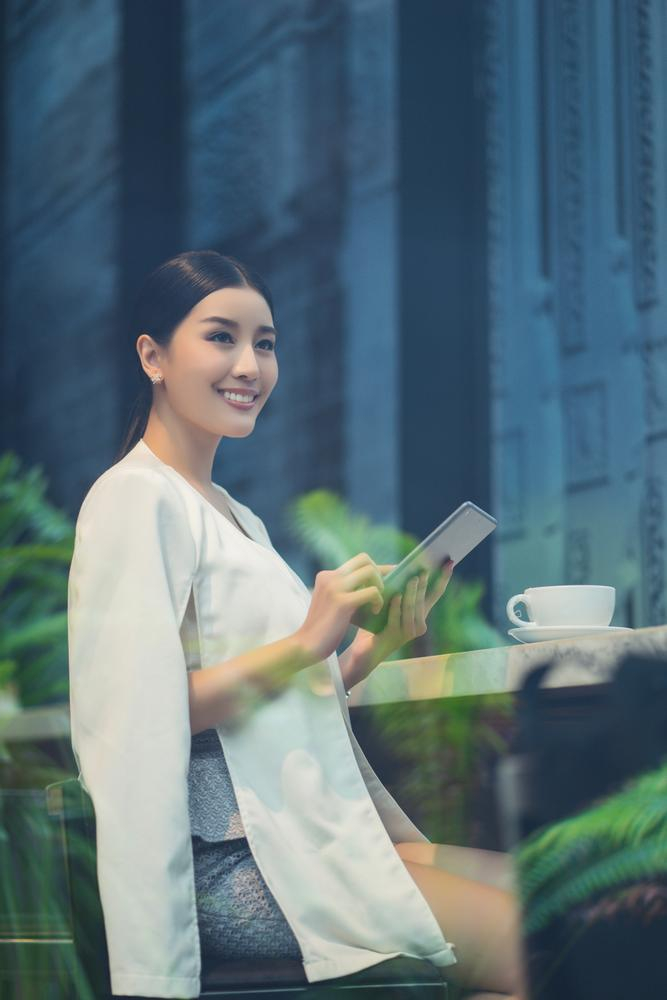 young,lady,using,tablet,smiling,café,indoors,officer,confident,thailand,asian,women,thai,joy,inside,youth,ponytail,long hair,worker,employee,happy,elegant,olive skin,costume,expression,attractive,fashionable,cup,white,asia,female,portrait,watching,adolescent,woman,morning,adult,pretty,lifestyle,beautiful,beauty,black hair,prettiness,twenties,professional,xframe